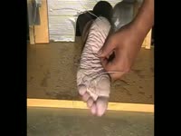 Trapped amateur husband has his bare foot tickled and pierced in this rare bdsm movie